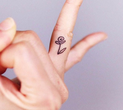 Abstract or minimalist finger tattoo