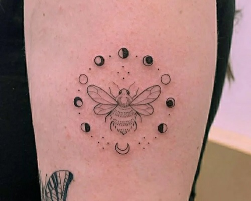 Arm bee tattoo
