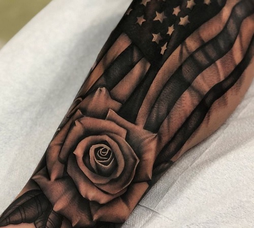Black American flag tattoo with a rose