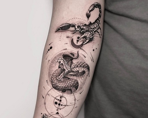 Black and white scorpion tattoo with a snake