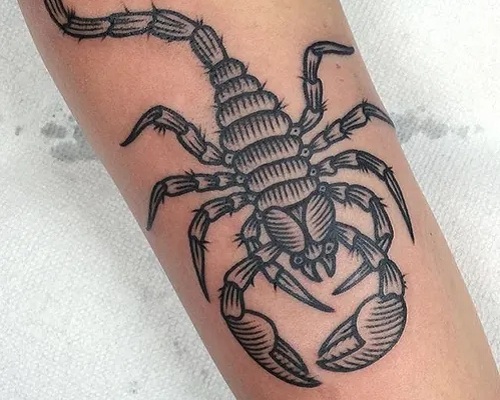 Black linework scorpion tattoo