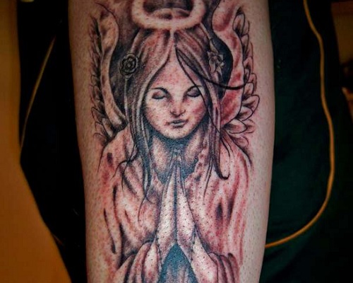 Female angel tattoo