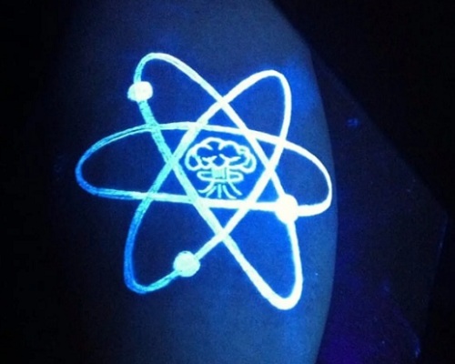 Glow-in-the-dark atom tattoo