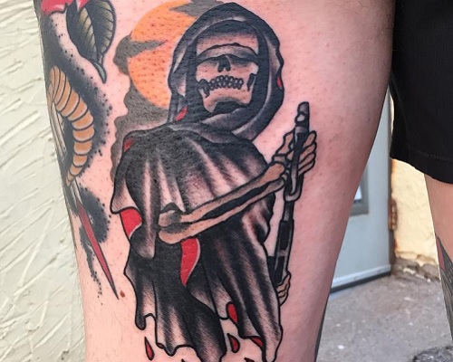Grim Reaper with a gun tattoo