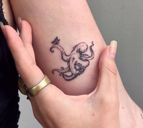 Hand-poked little octopus tattoo