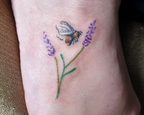 Heather flower tattoo with a bee