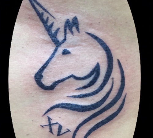 Minimalist unicorn tattoo design