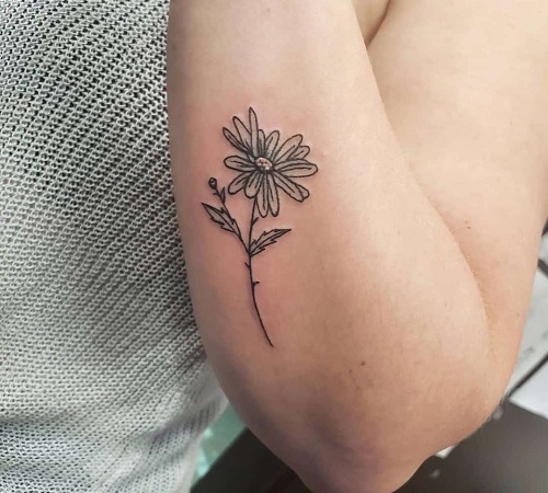 Minimalistic Aster flower tattoo