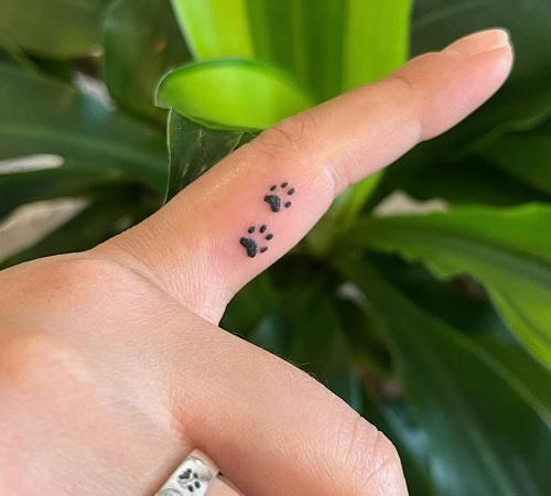 Paw print tattoo on a finger