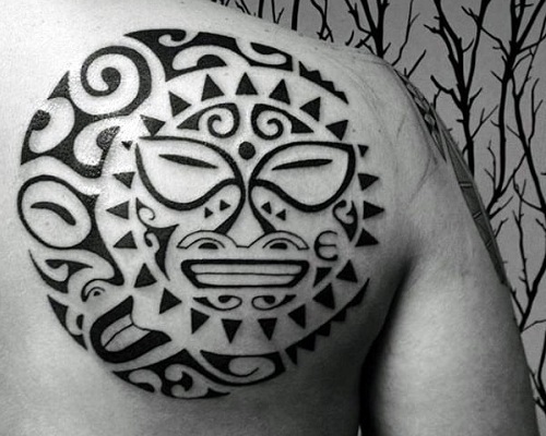 Tribal sun and moon tattoo