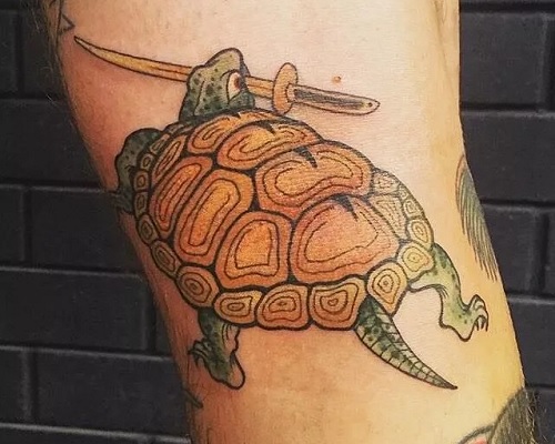 Turtle with a sword tattoo