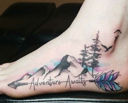 Watercolor mountain tattoo on the foot