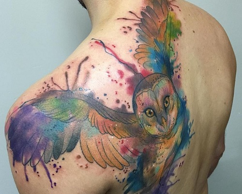 Watercolor owl tattoo on the back