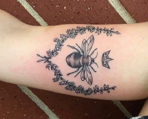 White heather flower tattoo with a queen bee
